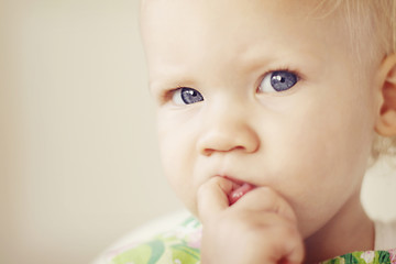 Image showing Portrait of a thoughtful looking toddler.