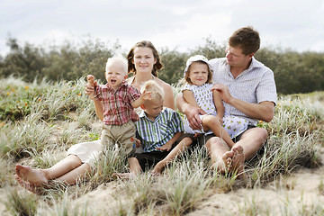 Image showing Family enjoying themselves at the beach.