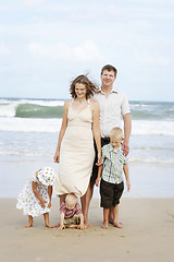 Image showing Family enjoying themselves at the beach.