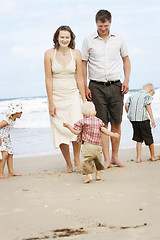 Image showing Family enjoying themselves at the beach.