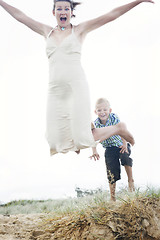 Image showing Mother and son having fun at the beach.