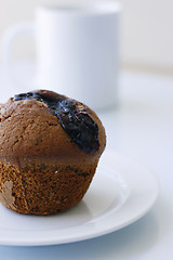 Image showing Blueberry muffin on a white plate.