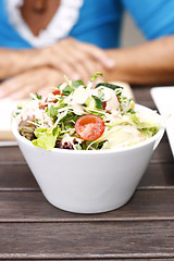 Image showing Delicious garden salad in a white bowl.