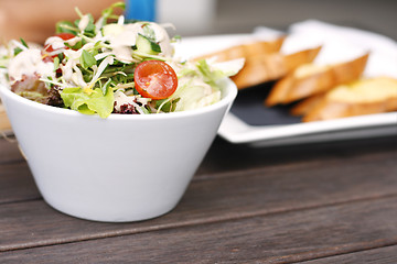 Image showing Delicious garden salad in a white bowl.