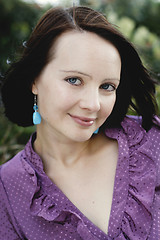 Image showing Close-up portrait of a smiling beautiful woman outdoors.