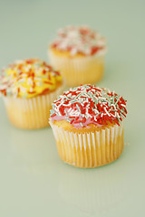 Image showing Brightly colored cupcakes.