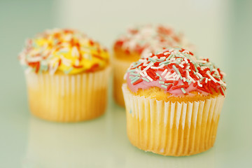 Image showing Brightly colored cupcakes.