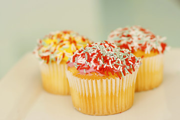 Image showing Brightly colored cupcakes.