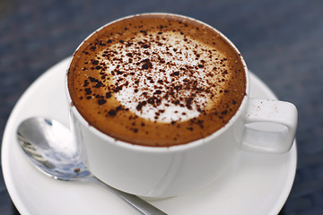 Image showing Delicious cappuccino in a white cup.