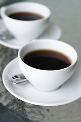 Image showing Two black filter coffees in white cups.