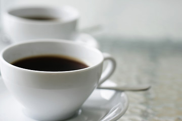 Image showing Two black filter coffees in white cups.