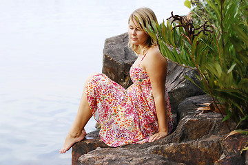 Image showing Beautiful young blonde woman at the water’s edge.