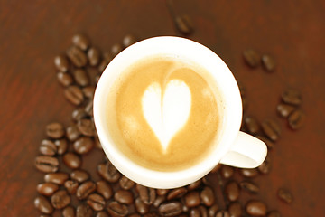 Image showing Top view of piccolo latte with a coffee art design.