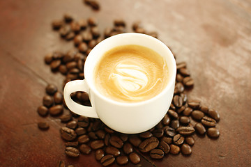 Image showing Piccolo latte with a coffee art design.