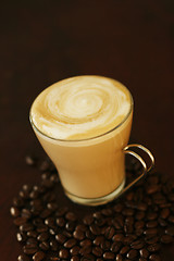 Image showing Delicious latte in glass with coffee art swirl design.