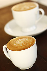 Image showing Two delicious lattes on a table.