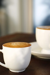 Image showing Two delicious lattes on a table.