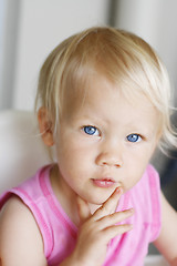 Image showing Portrait of a thoughtful looking toddler.