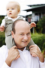 Image showing Close-up portrait of a father and son outdoors.