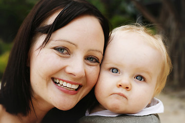 Image showing Close-up portrait of a mother and son outdoors.