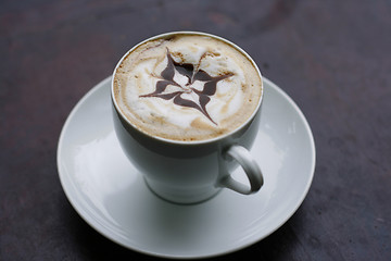 Image showing Delicious cappuccino with star design.