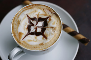 Image showing Delicious cappuccino with star design.