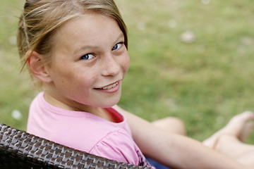 Image showing Close-up portrait of a pretty, blonde haired teenage girl outdoo