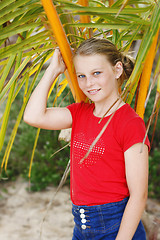 Image showing Pretty, blonde haired teenage girl outdoors at the beach.