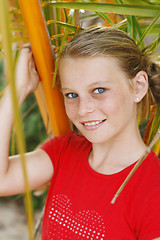 Image showing Pretty, blonde haired teenage girl outdoors.