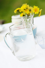 Image showing Jug of water and glasses on a table.