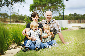 Image showing Portrait of a happy family outdoors in a park.