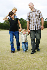 Image showing Happy family outdoors.