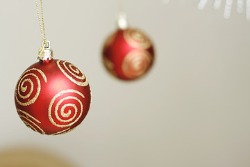 Image showing Two red decorative Christmas baubles.