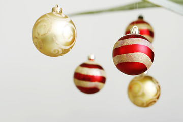 Image showing Hanging decorative Christmas baubles.