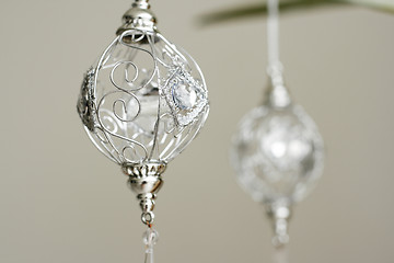 Image showing Sparkly silver colored Christmas baubles.