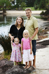 Image showing Family enjoying themselves in an outdoor nature setting.