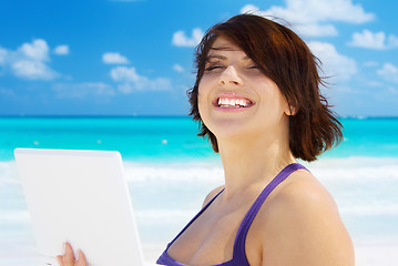 Image showing woman with laptop computer on the beach