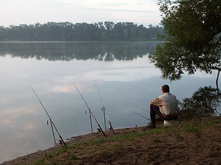 Image showing The fisherman with fishing tackles