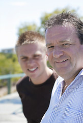 Image showing Happy father and son together outdoors.