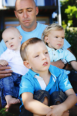 Image showing Father and sons together outdoors.