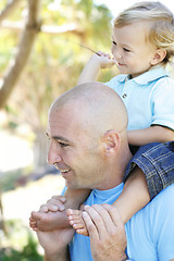 Image showing Close-up portrait of a father and son outdoors.