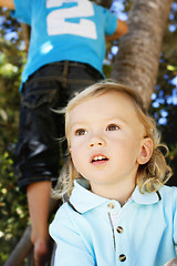 Image showing Portrait of a thoughtful looking little boy outdoors.