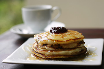 Image showing Stack of pancakes and coffee cup.