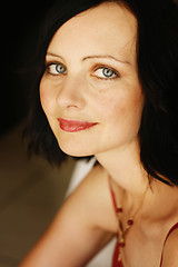 Image showing Portrait of a beautiful woman in a red outfit.