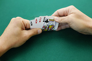 Image showing Aces, a two and a king double suited.