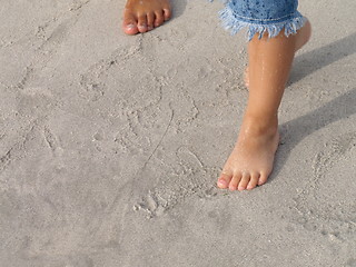 Image showing kids feets on sand