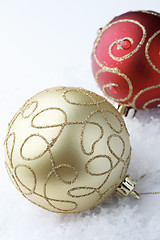 Image showing Red and gold Christmas bauble decorations.