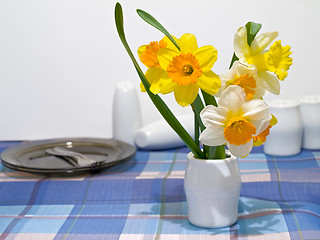 Image showing narcissus and crockery