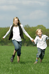 Image showing brother and sister have fun together