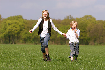 Image showing brother and sister have fun together